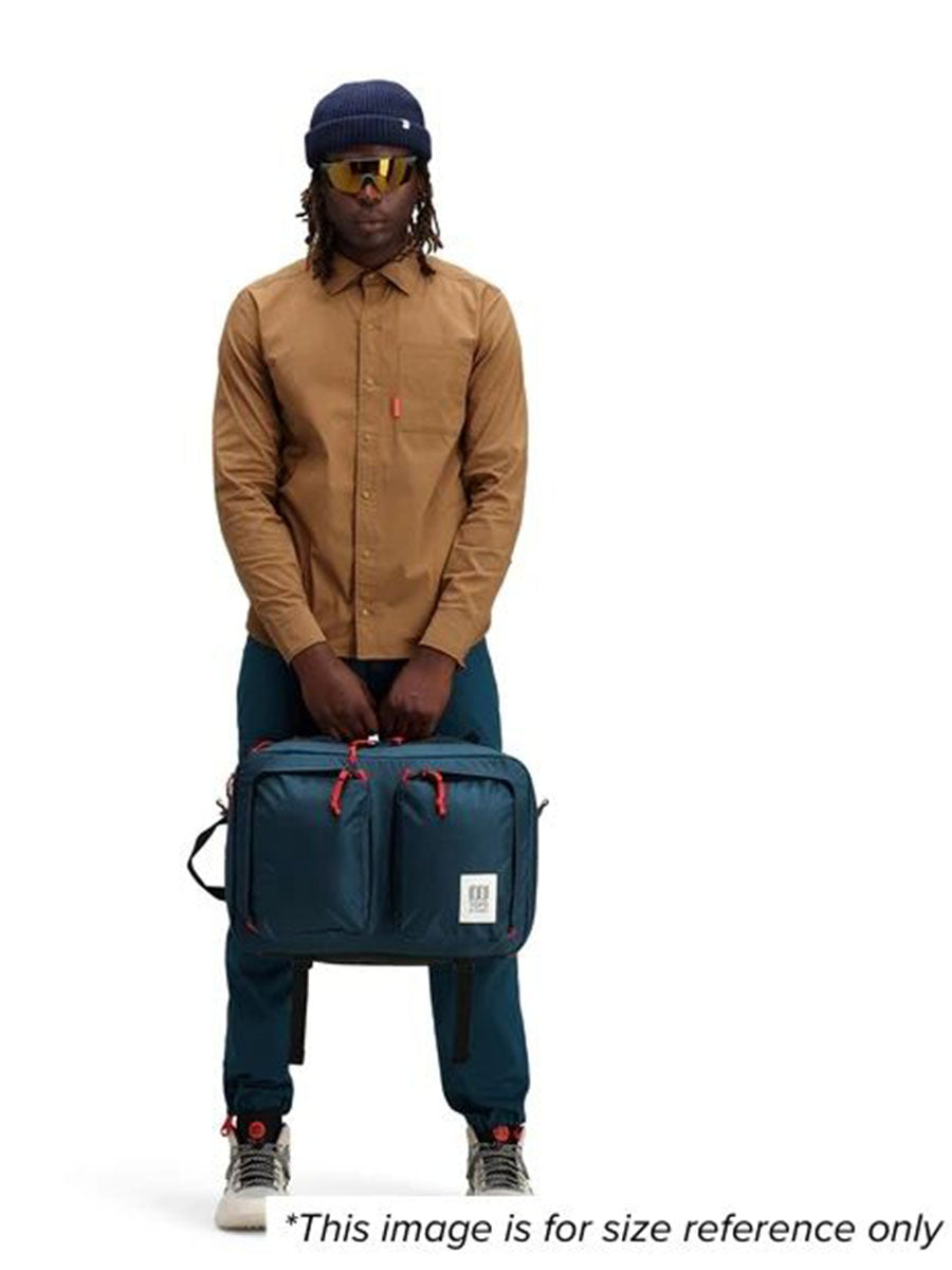 A man showcasing a bag for size reference.
