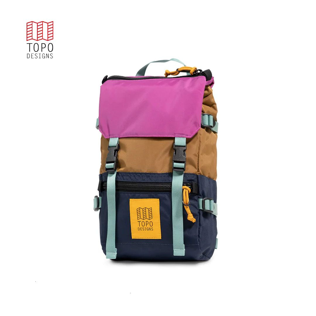 A colorful Rover Pack Mini Backpack with pink, brown, and blue compartments, featuring heavy-duty zippers and a top carry handle.