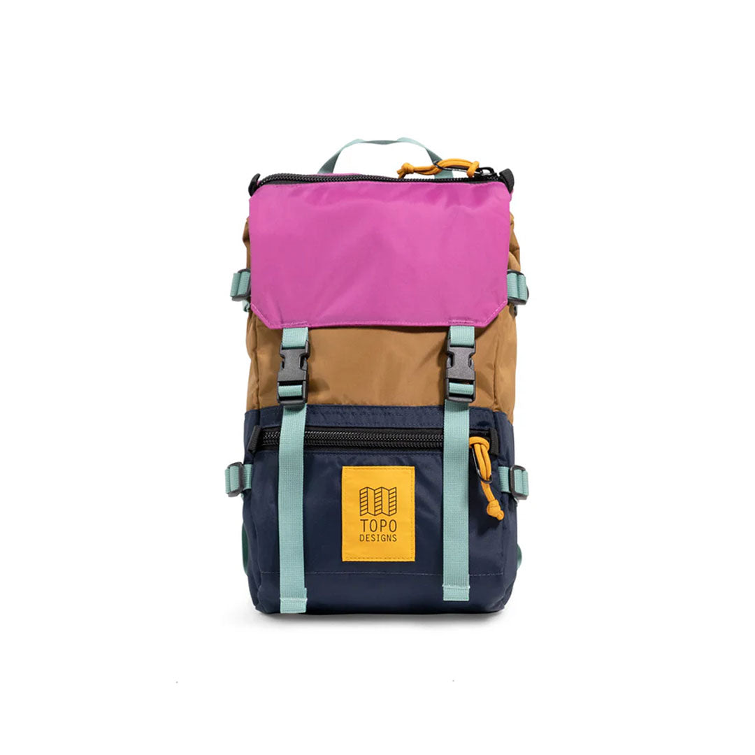 A colorful Rover Pack Mini Backpack with pink, brown, and blue compartments, featuring heavy-duty zippers and a top carry handle.