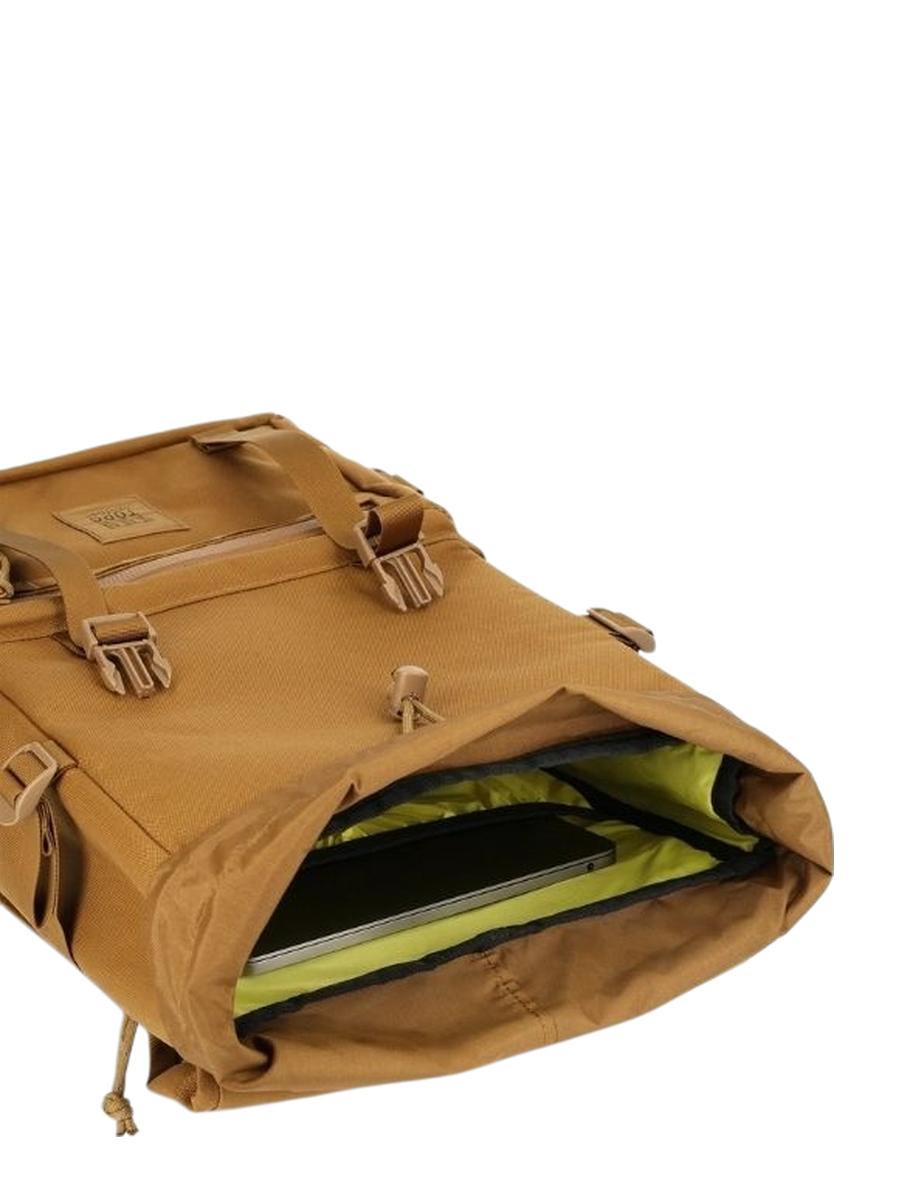 A brown Rover Pack Tech Backpack showcasing its insides.