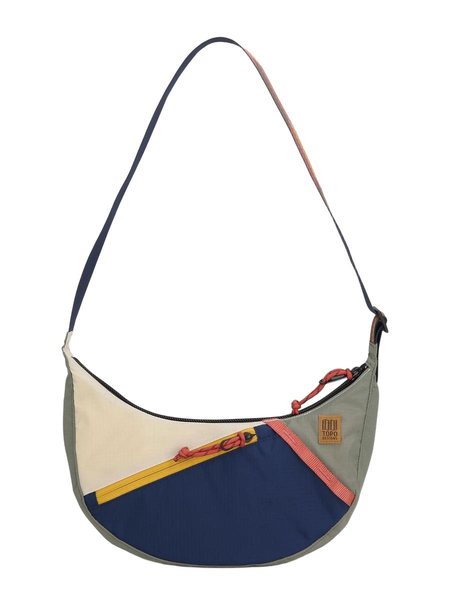 A Moonlight Crossbody Bag with a geometric pattern in multicolor, featuring an adjustable shoulder strap, front zippered pocket, and a small, compact design.