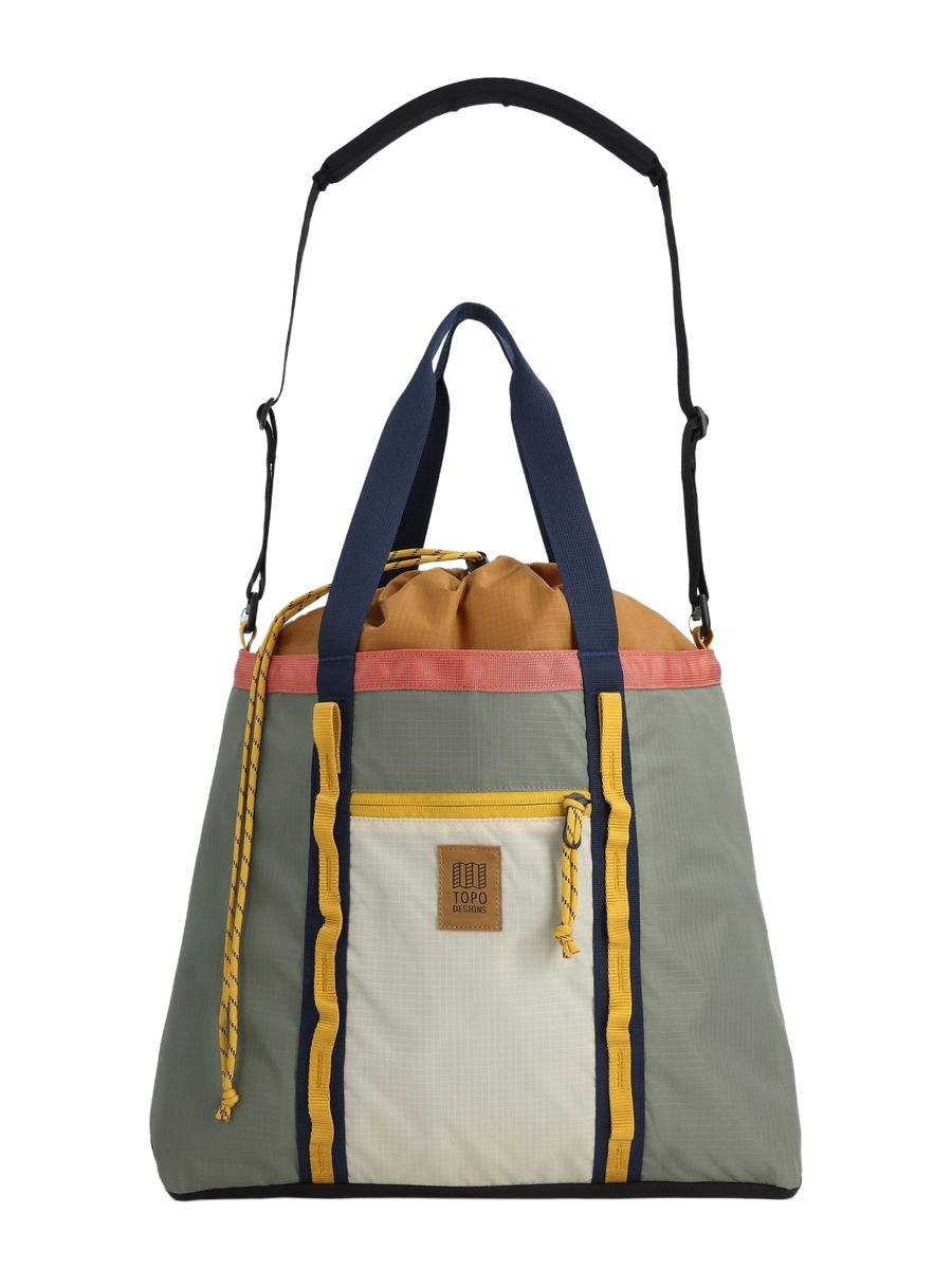 A multicolored Mountain Utility Tote Shoulder Bag with a gray base, yellow and pink accents, and a navy blue adjustable padded shoulder strap.