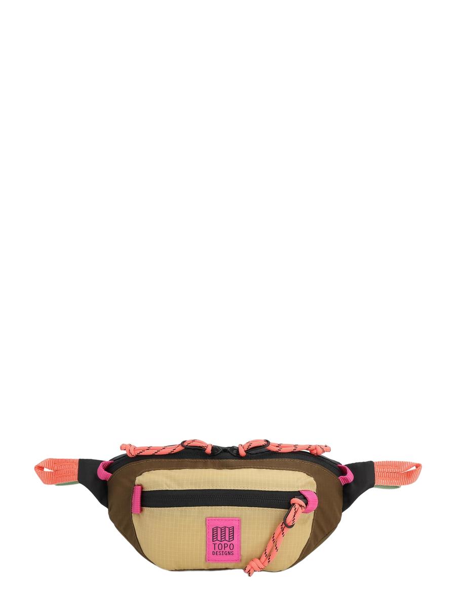 A beige Mountain Waist Pack with pink and black trim, featuring two pockets and heavy duty zippers, seated against a white background.