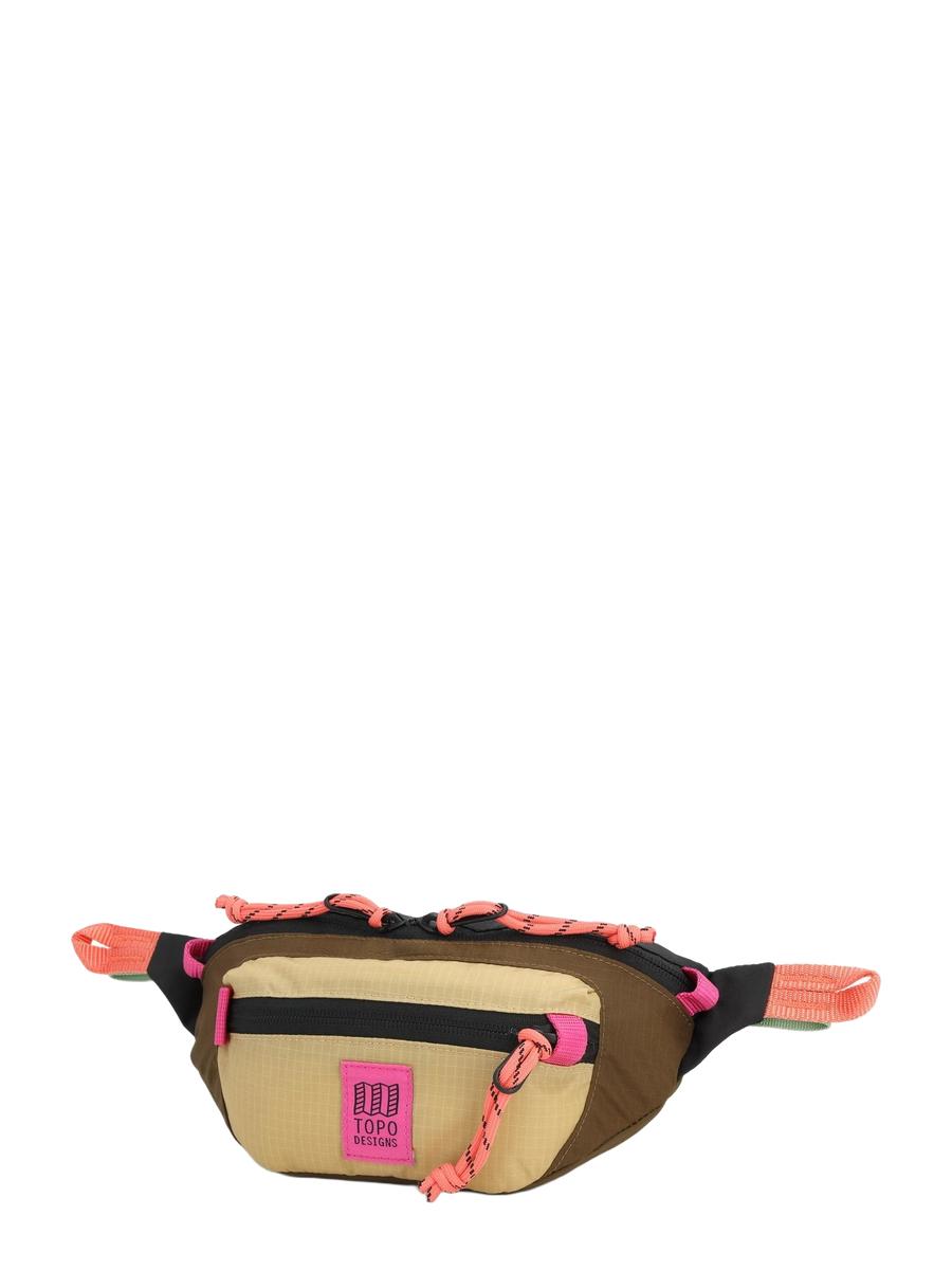 A beige Mountain Waist Pack with pink and black trim, featuring two pockets and heavy duty zippers, seated against a white background.